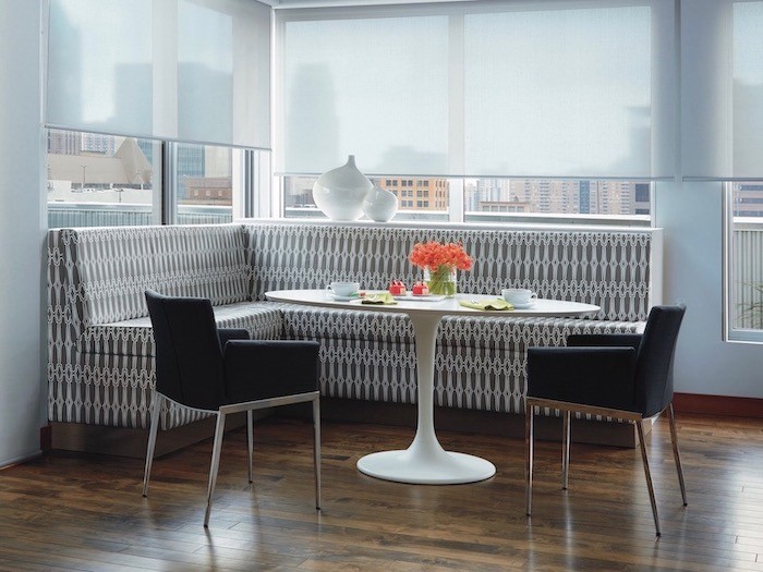 A dining area with built-in seating.